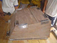 The hinged sides of the solar box cooker mold make precise bends in the aluminum